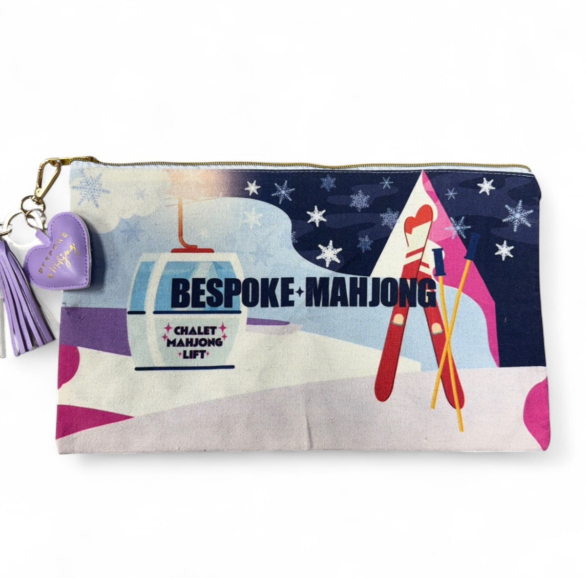 The Chalet Mahjong Lift ski-scene tile bag with purple puffy heart zipper pull and tassel
