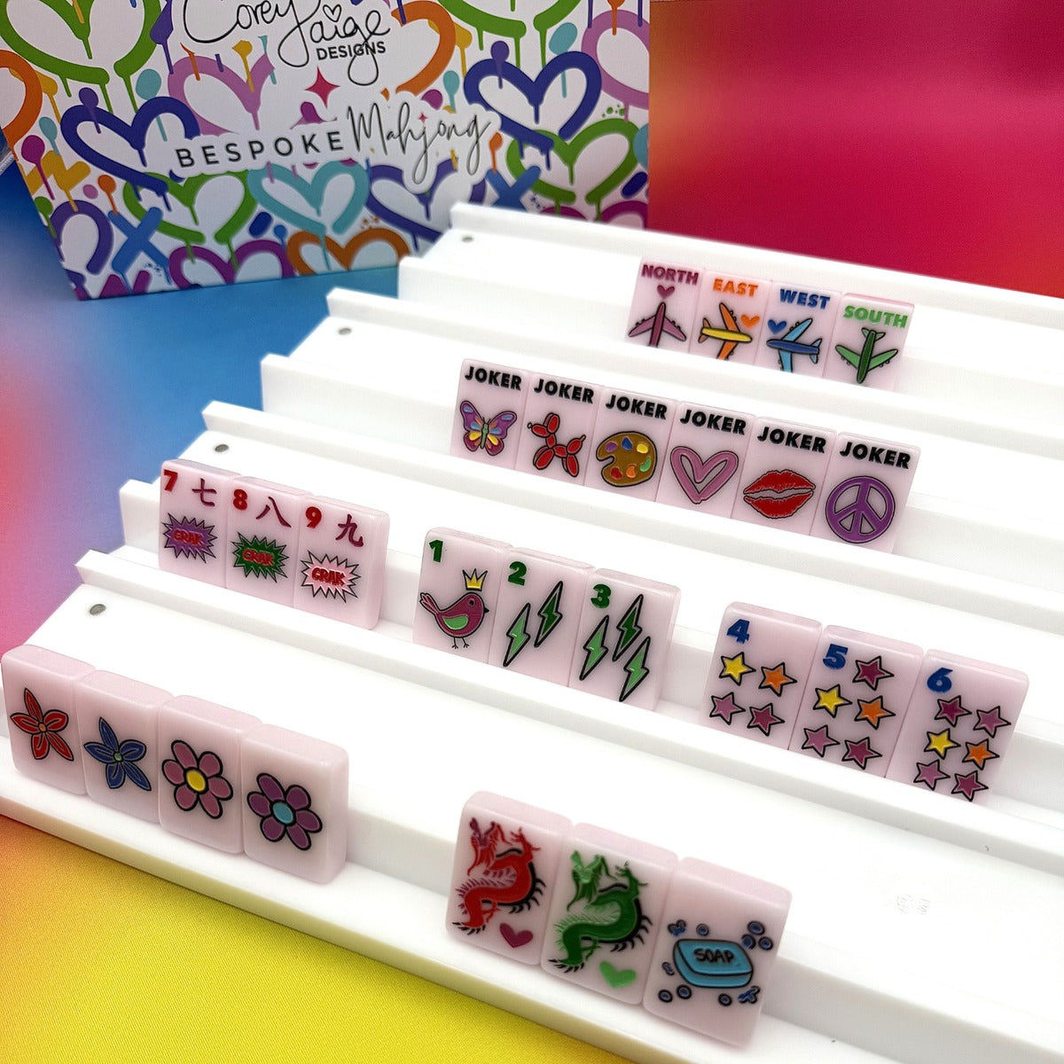 Corey Paige Color Crush Powder Pink tiles on white racks with the Corey Paige heart-print tile bag; racks sold separately