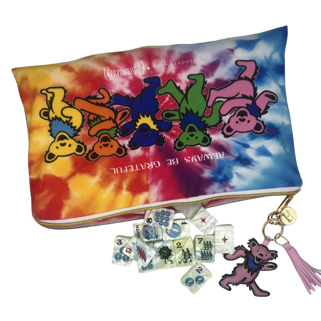 Grateful Dead x Bespoke Mahjong tie-dye Dancing Bears tile bag with Stealie Blue pearl tiles spilling out and the pink puffy Dancing Bear zipper pull
