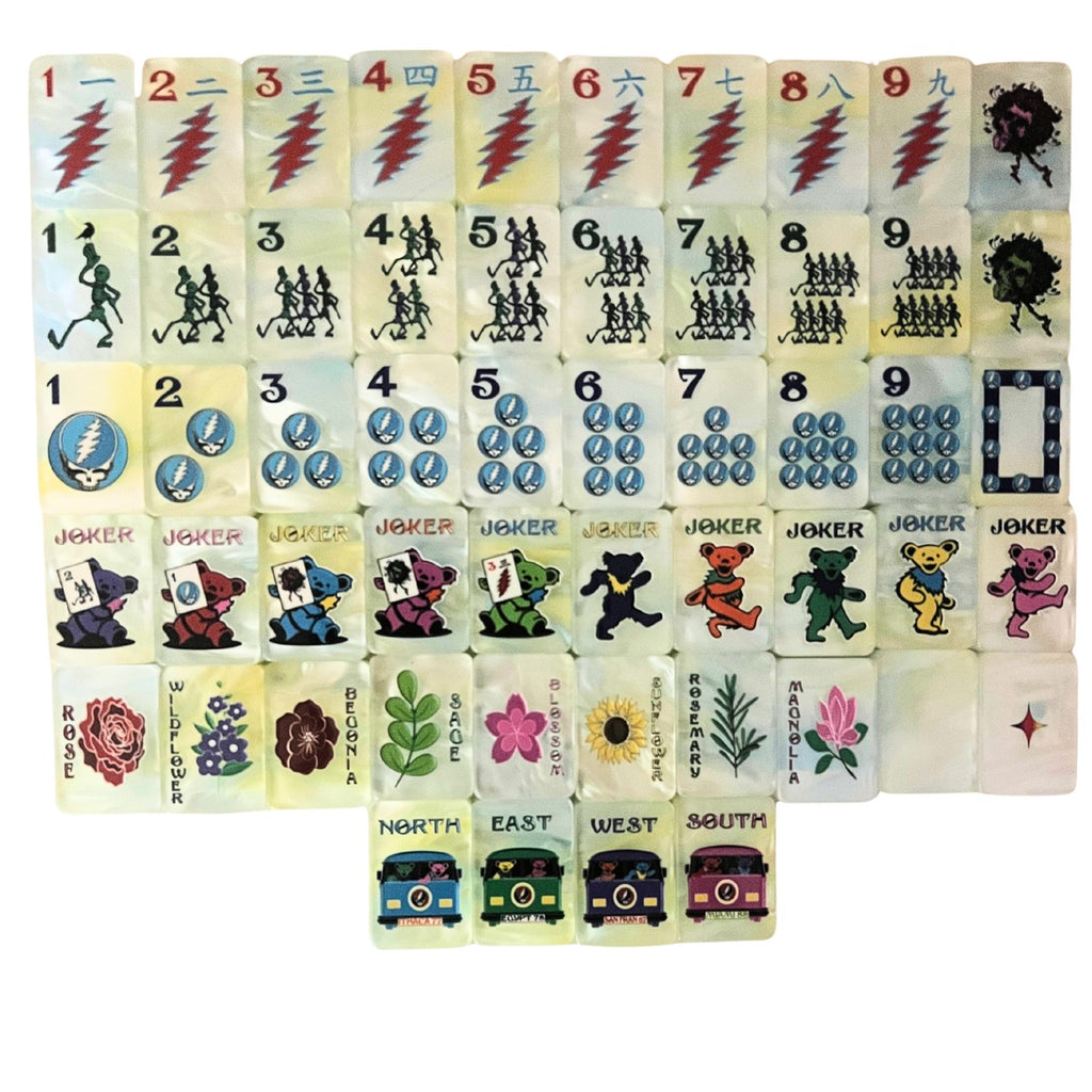 One of each Grateful Dead x Bespoke Mahjong Sunshine Daydream Tie Dye Pearl tile: lightning-bolt craks, dancing-skeleton bams, Steal Your Face dots, Dancing Bear jokers, named flowers, and tour-bus winds on pale yellow pearl