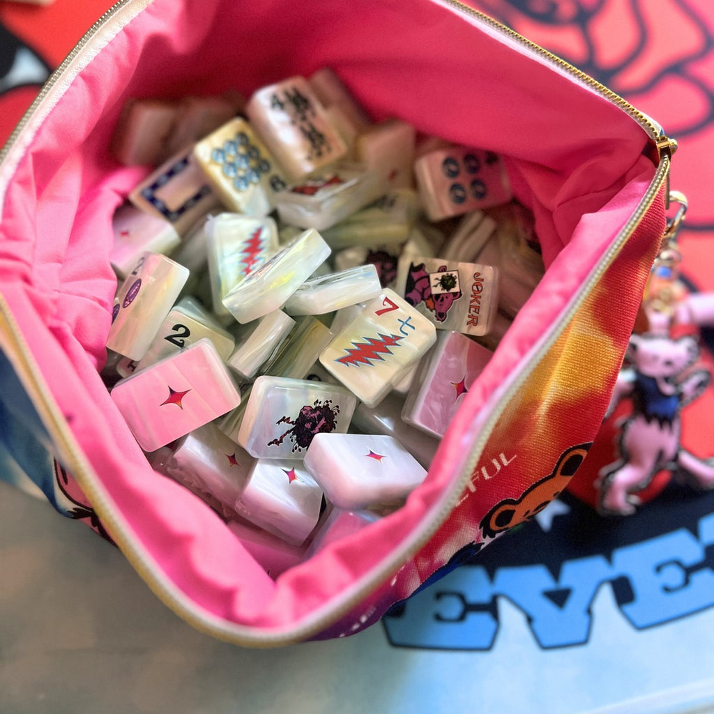 Sunshine Daydream pearl tiles inside the pink-lined Grateful Dead x Bespoke Mahjong tile bag