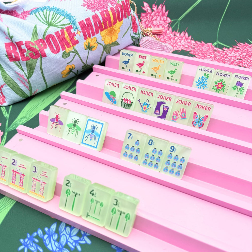 Garden Glow Matcha Pearl tiles on pink racks with the floral Bespoke Mahjong tile bag; racks and mat sold separately