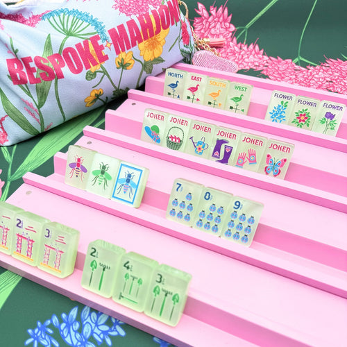 Garden Glow Matcha Pearl tiles on pink racks with the floral Bespoke Mahjong tile bag; racks and mat sold separately