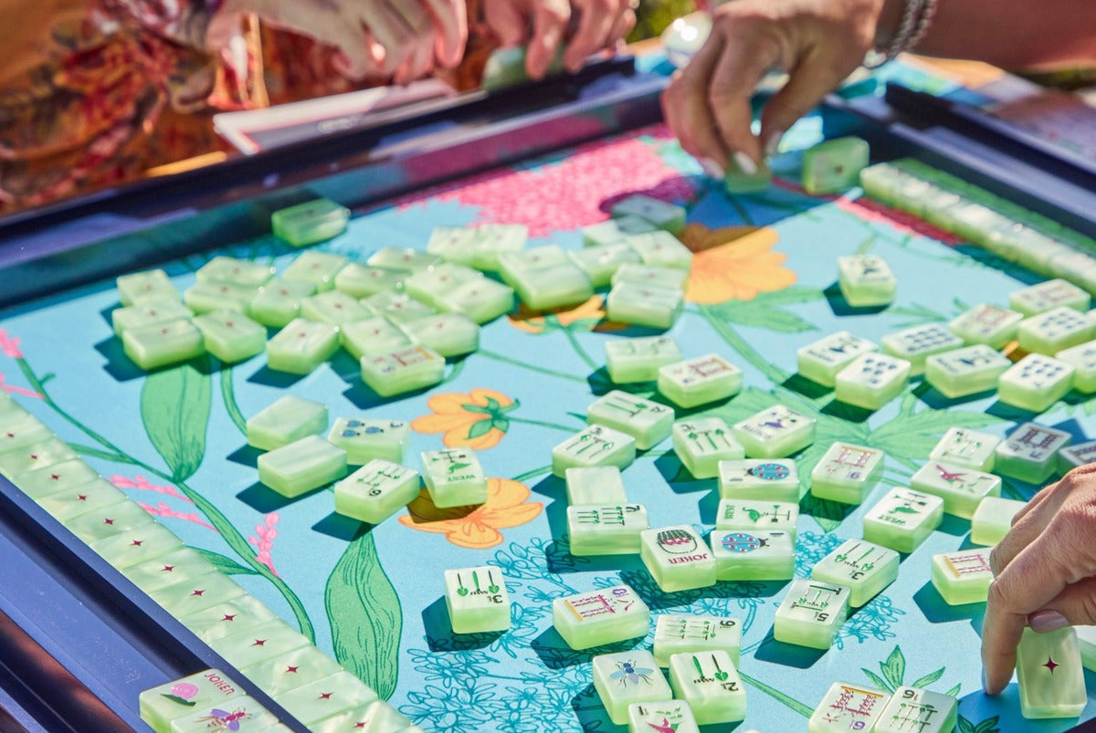 Players mixing Garden Glow Matcha Pearl tiles on a floral mat; mat sold separately