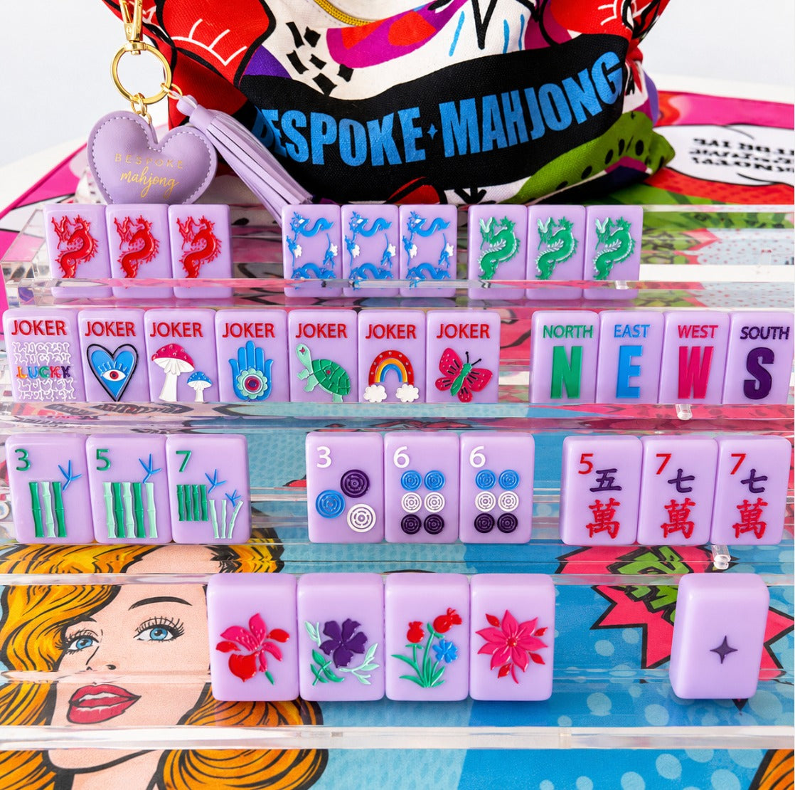 Lucky Charms French Lavender tiles on clear racks with the Bespoke Mahjong tile bag; racks and mat sold separately