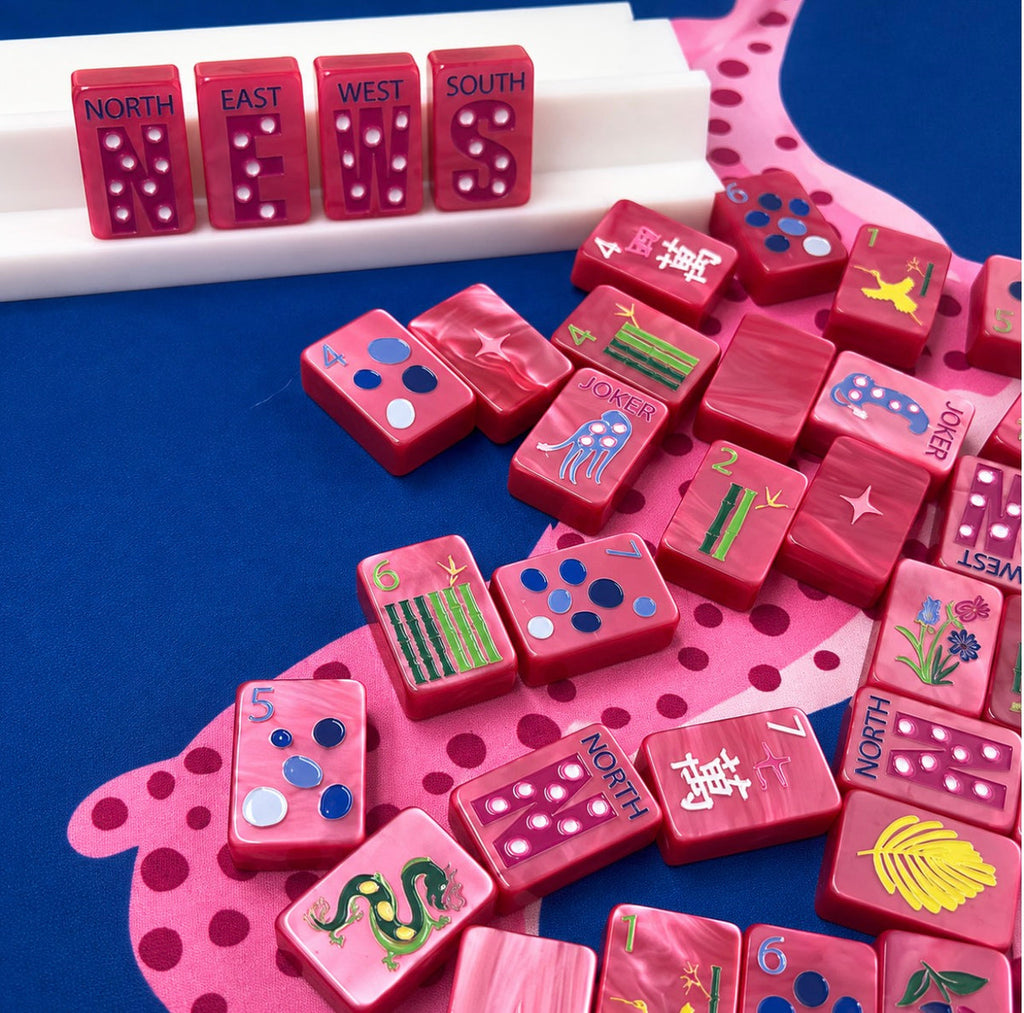 Close-up of Springtime Safari Wild Pink Pearl tiles showing NEWS winds, dots, bams, and cheetah jokers; racks and mat sold separately