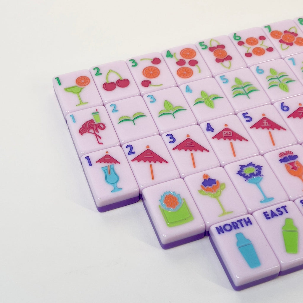 Angled close-up of Cocktail Club 2.0 tiles showing citrus dots, mint bams, umbrella craks, and cocktail flowers