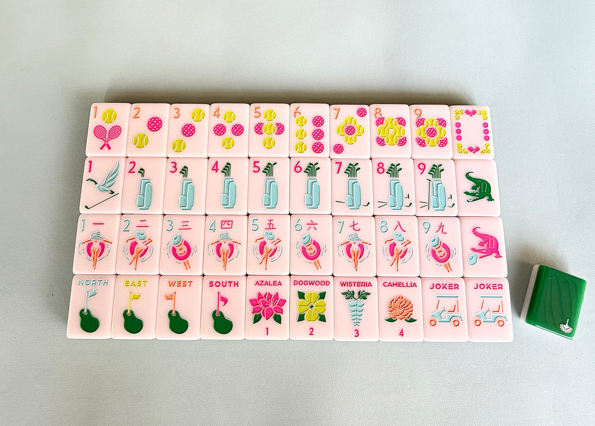 One of each Charleston Mahjong Club Country Club tile face laid out in rows: tennis-ball dots, golf-bag bams, pool-float craks, golf-flag winds, named flowers, and golf-cart jokers, with a green tile back