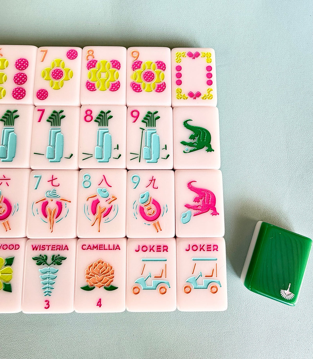Close-up of Country Club tiles showing the nine dots, green and pink gator dragons, Wisteria and Camellia flowers, and golf-cart jokers