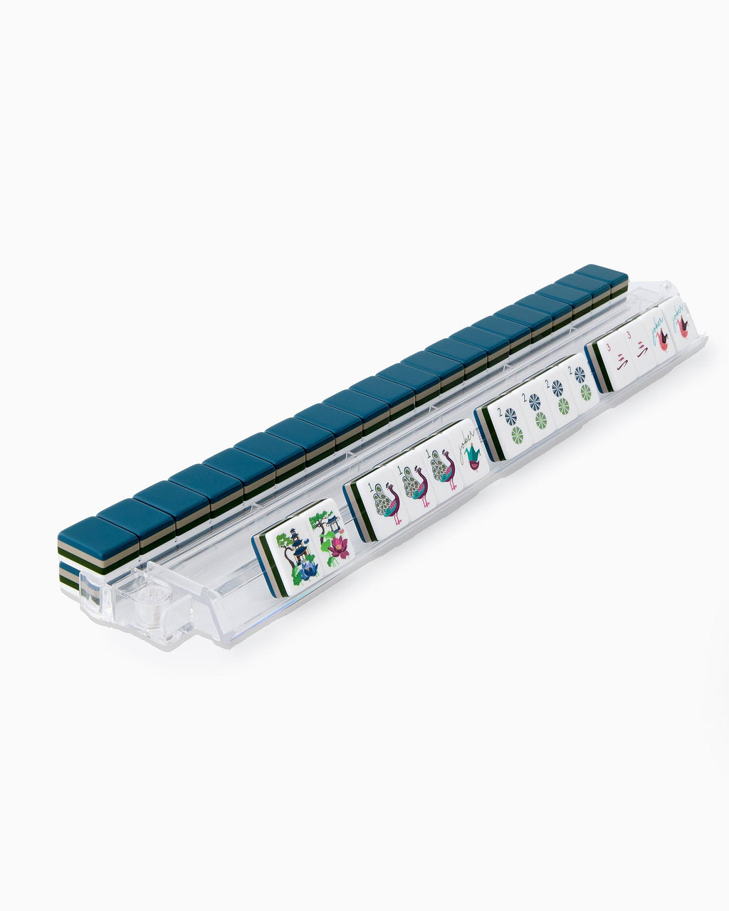 Gatsby mahjong tiles on a clear acrylic rack, a row of face-up tiles in front and navy tile backs lined up behind