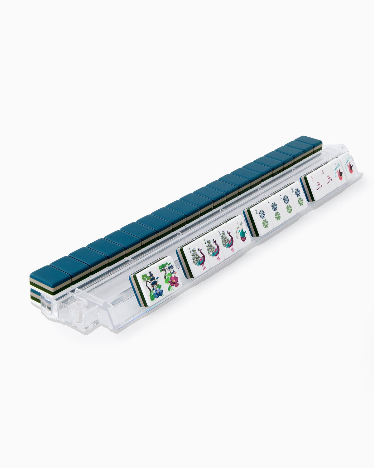 Gatsby mahjong tiles on a clear acrylic rack, a row of face-up tiles in front and navy tile backs lined up behind