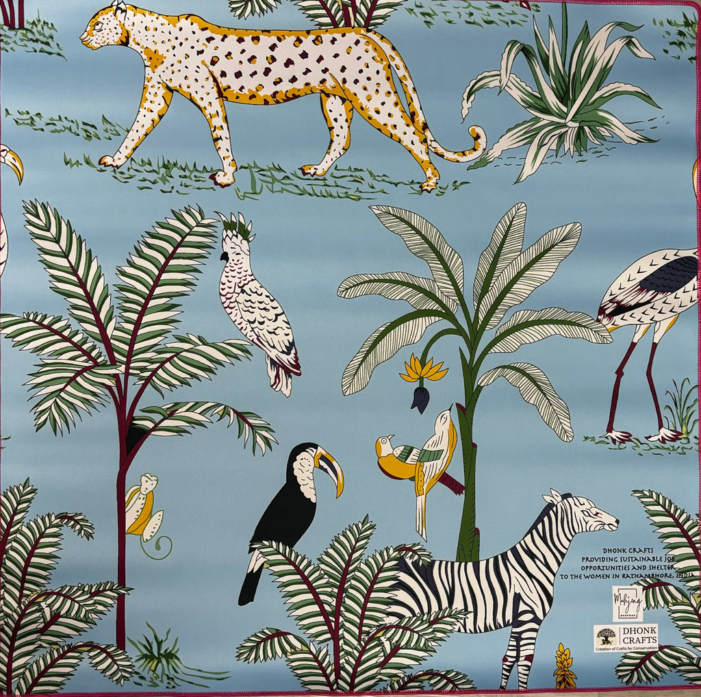 Turquoise side of the Dhonk jungle mahjong mat with cheetahs, toucans, and palms
