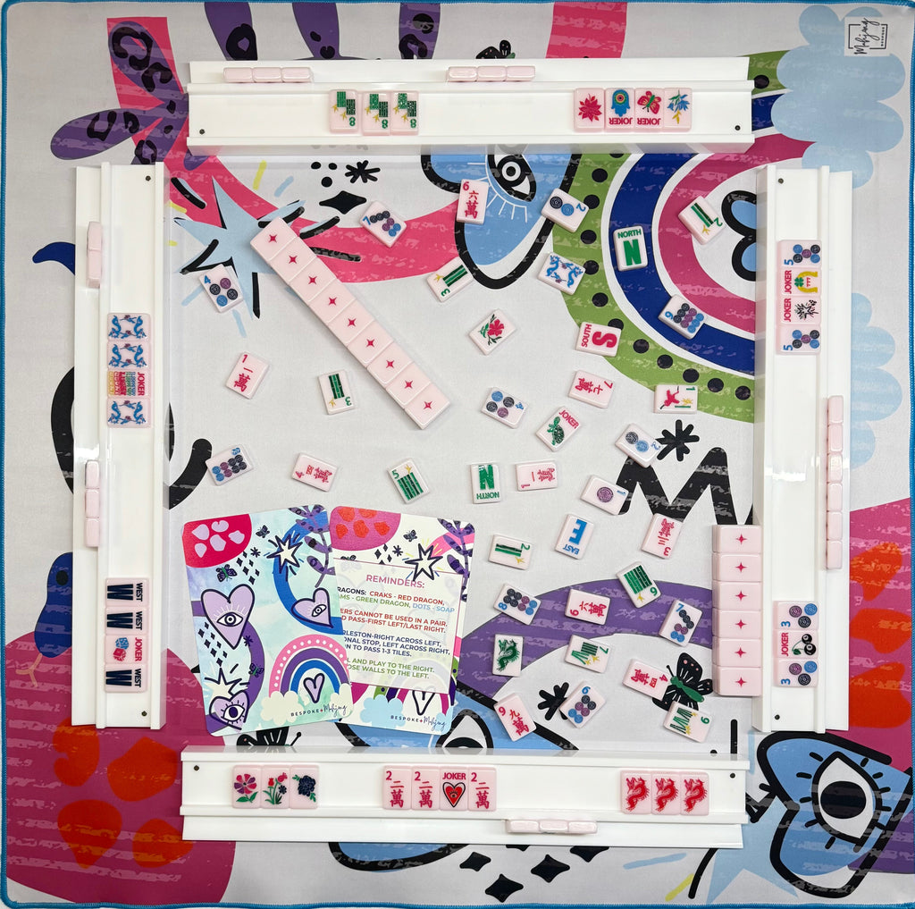 Lucky Charms Part Deux mahjong mat set up with racks and tiles; tiles and racks sold separately