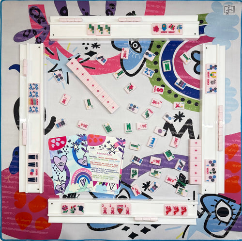 Lucky Charms Part Deux mahjong mat set up with racks and tiles; tiles and racks sold separately