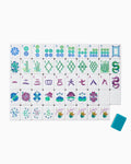 One of each Oh My Mahjong Lagoon tile face laid out in rows: dots, bams, craks, flowers, winds, and jokers, with a teal tile back