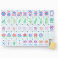 One of each Oh My Mahjong Sorbet tile face laid out in rows: dots, bams, craks, flowers, winds, and jokers, with a butter yellow tile back
