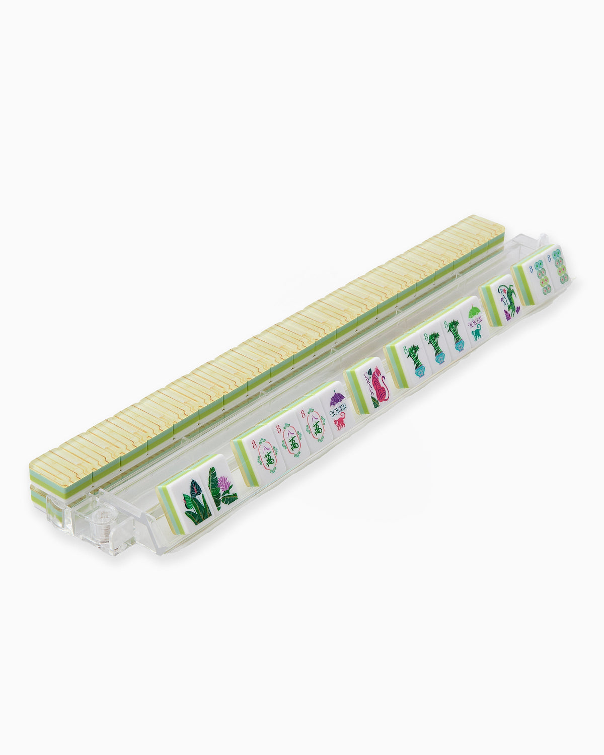 Palm Royale mahjong tiles on a clear acrylic rack, a row of face-up tiles in front and bamboo-look tile backs lined up behind