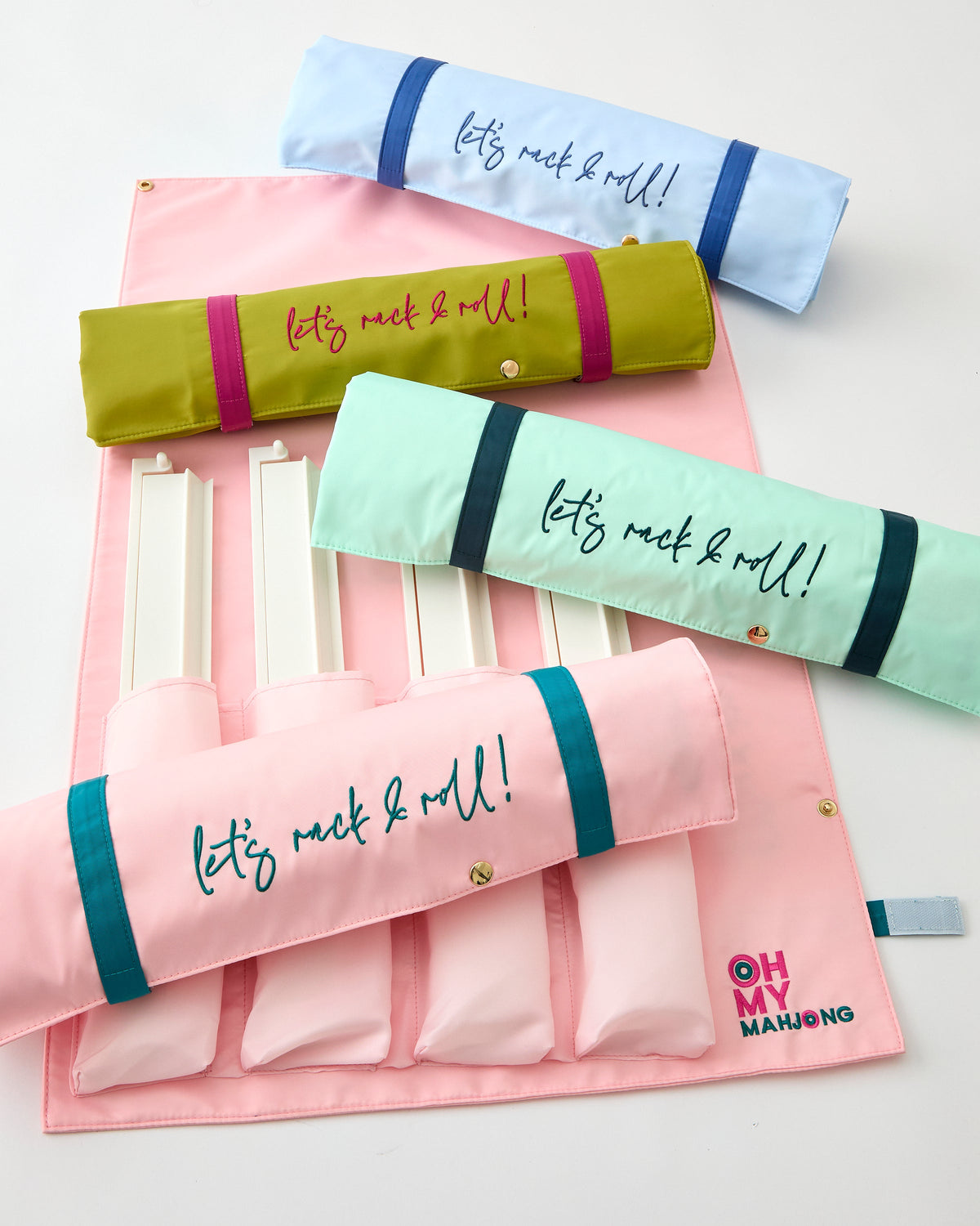 Oh My Mahjong Let's Rack & Roll bags in assorted colors, rolled and flat