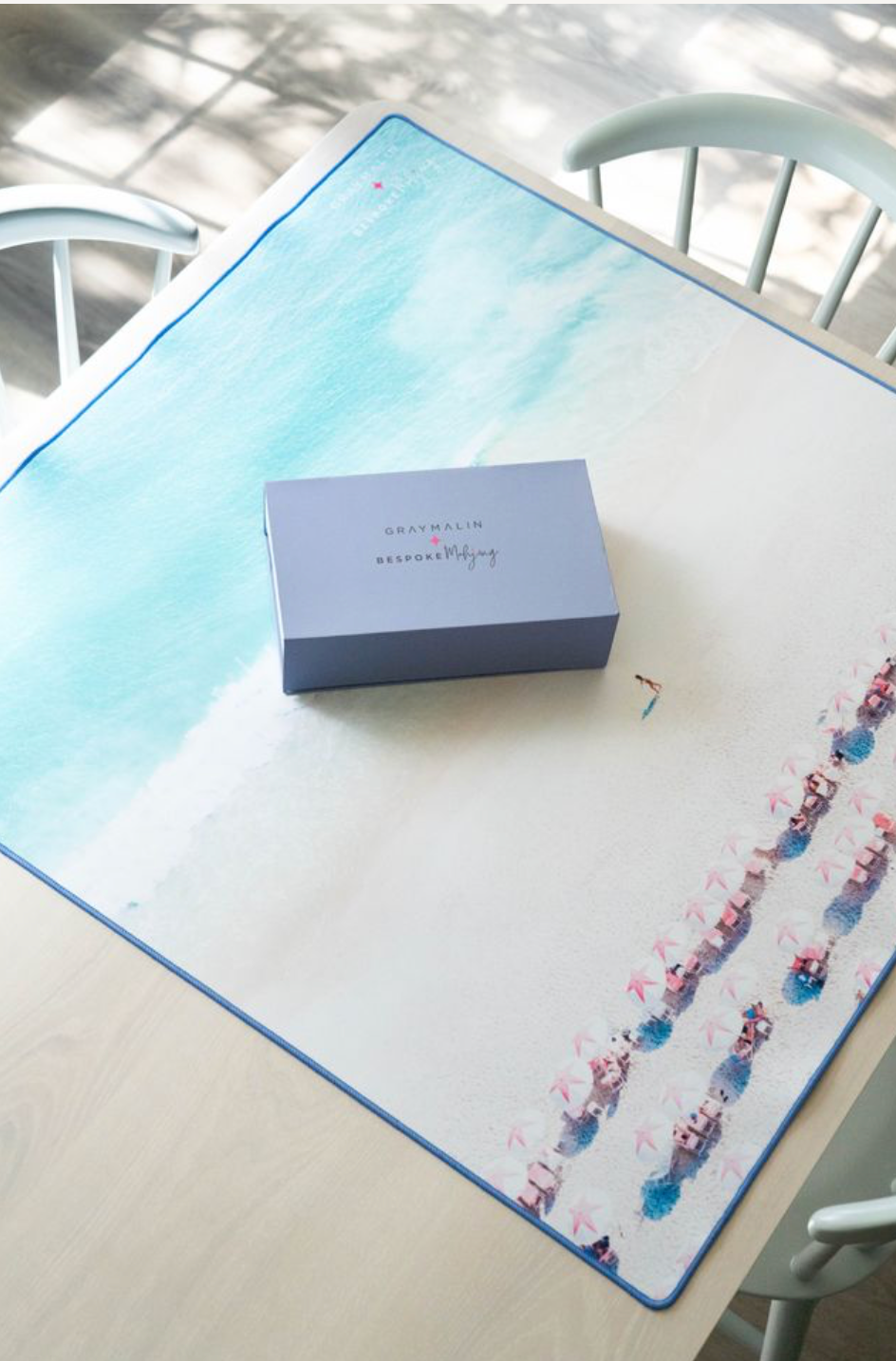 Gray Malin Beach Club mahjong mat on a table with a tile box; tiles sold separately