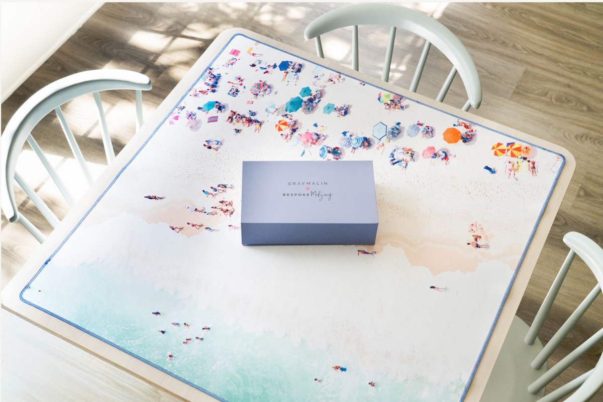 East Hampton side of the Gray Malin Beach Club mat on a game table with a tile box; tiles sold separately