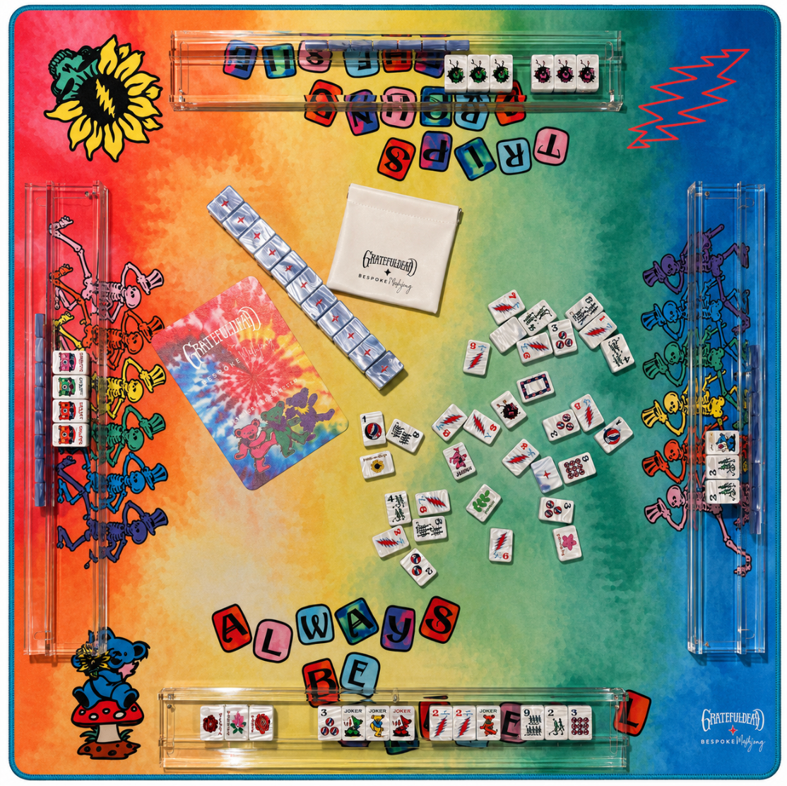 Rainbow tie dye side of the Grateful Dead mahjong mat set up with tiles and racks; tiles and racks sold separately