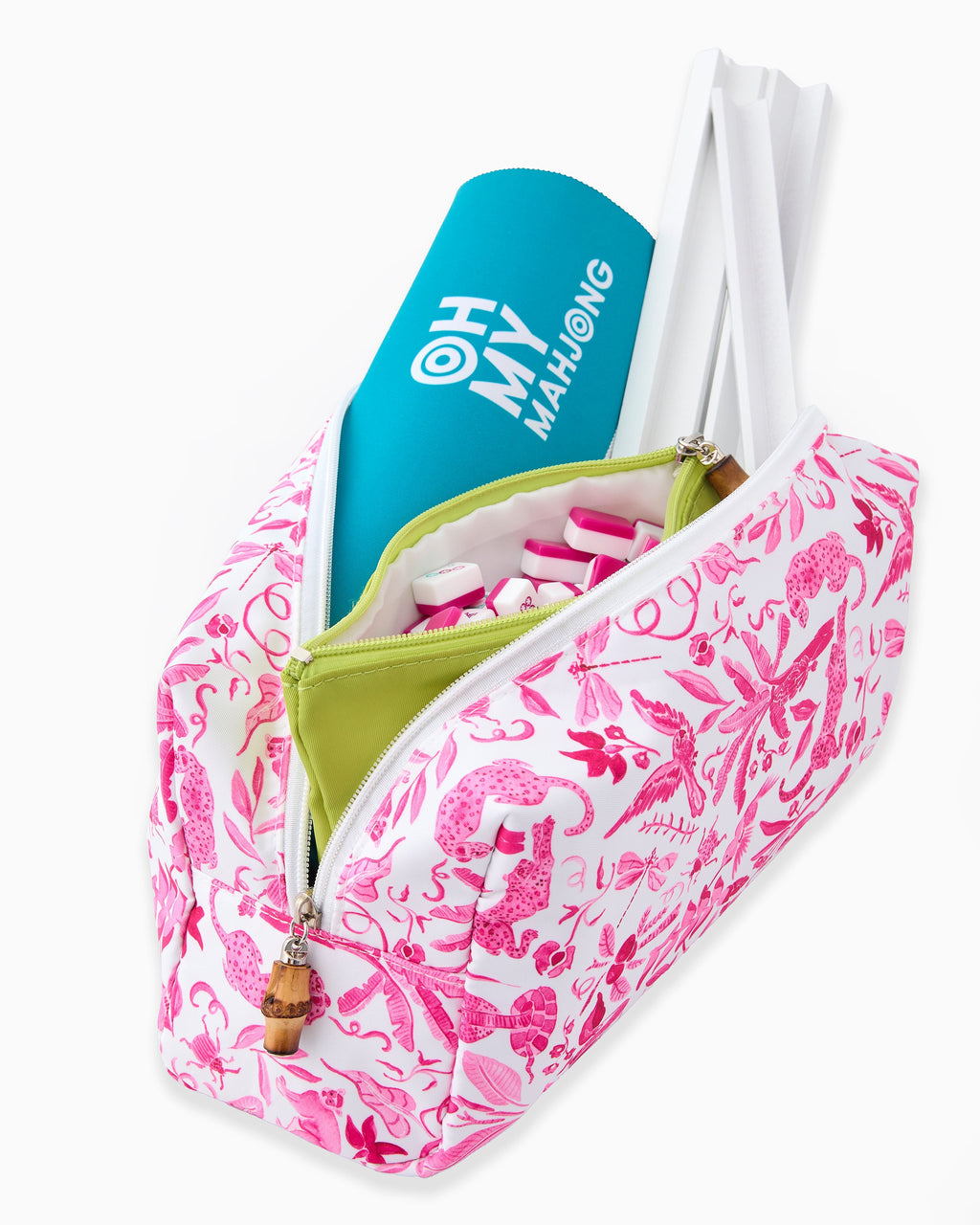Pink printed travel bag open with chartreuse tile pouch and racks