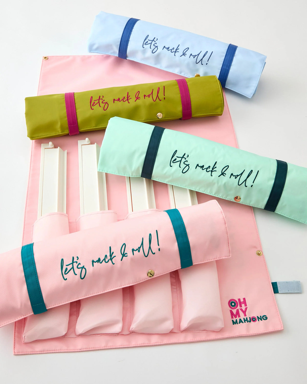 Light Pink Let's Rack & Roll bag rolled up beside the flat bag