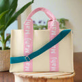 Oh My Mahjong Mahj It All bag in Light Pink with teal crossbody strap