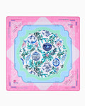 Oh My Mahjong Merriment holiday mahjong mat laid flat, evergreen sprigs and ornaments in pink, icy blue, and mint