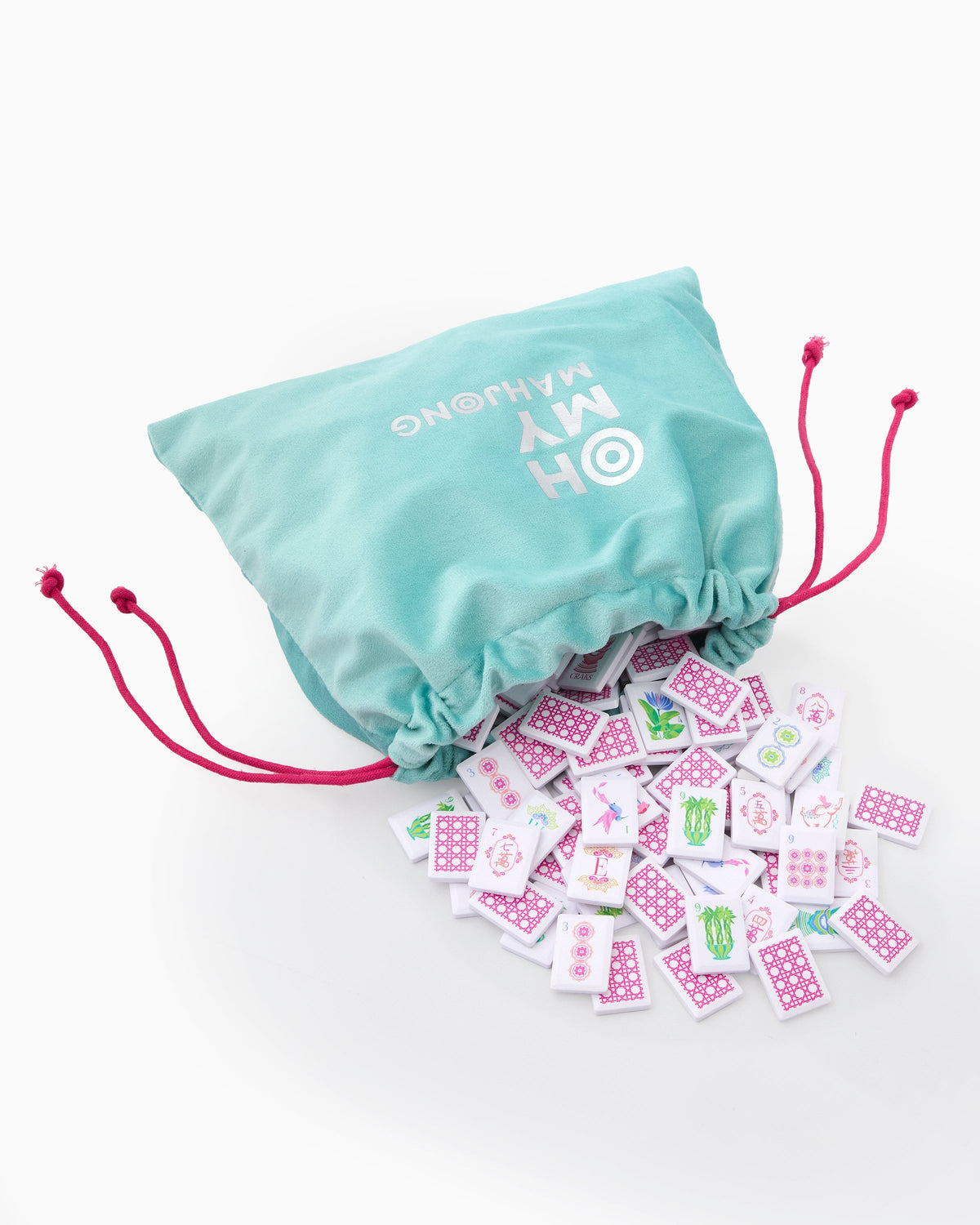 Poppy tiles spilling from the teal drawstring bag